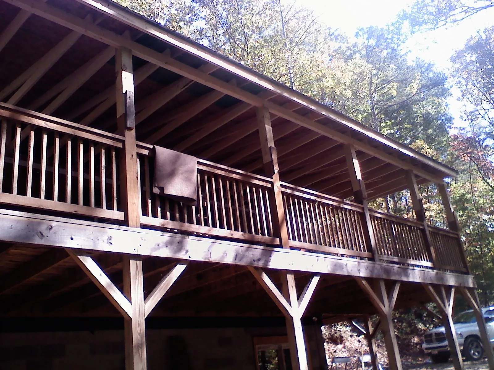 Timber framing under a new elevated porch and deck — Roof Leak Repair in Weare by Roofing Brothers